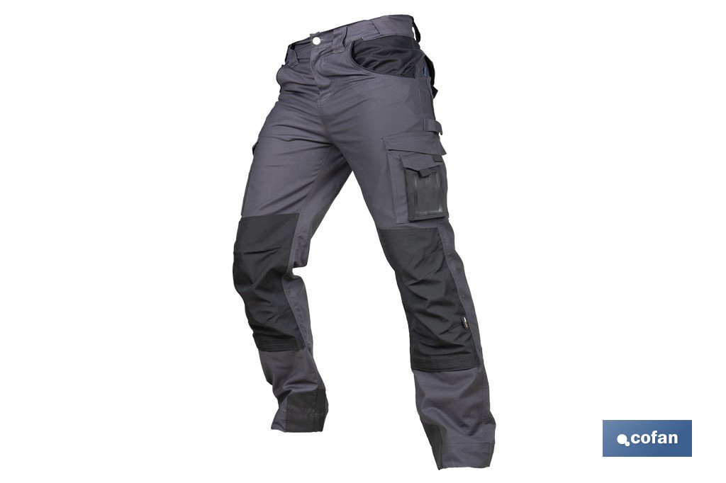 Pantalón de trabajo modelo Heimdall en gris oscuro y negro | Elástico, reforzado con múltiples bolsillos | Materiales: 65 % poliéster, 32 % algodón | Disponible en amplio rango de tallas - Cofan