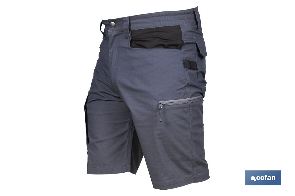 Bermudas de trabajo modelo Frigg en gris y negro | Elásticas, ligeras con múltiples bolsillos y protección lumbar| Materiales: 65 % poliéster y 32 % algodón | Disponibles en amplio rango de tallas - Cofan