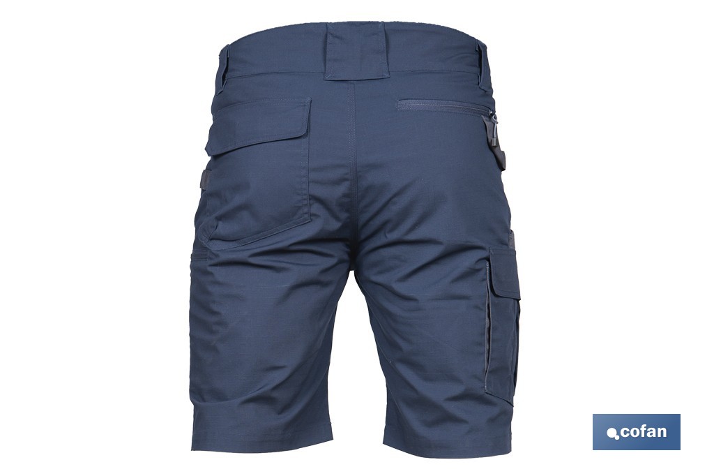 Bermudas de trabajo modelo Tyr en azul marino y negro | Elásticas, ligeras con múltiples bolsillos y protección lumbar| Materiales: 65 % poliéster y 32 % algodón | Disponibles en amplio rango de tallas - Cofan